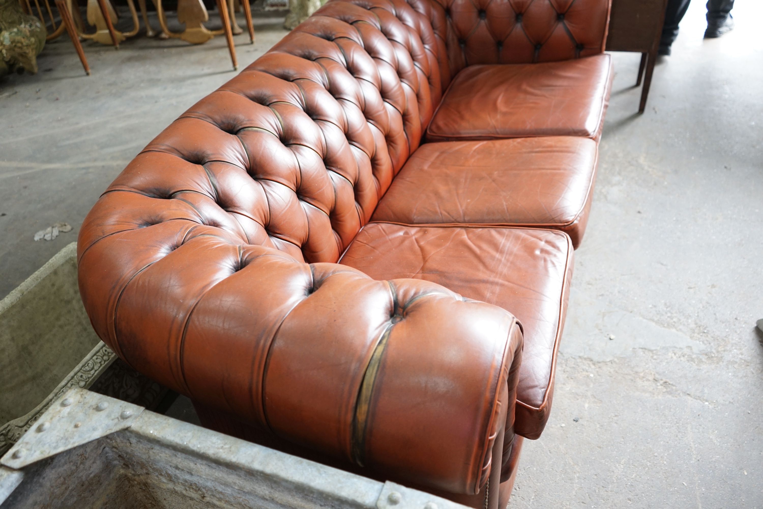 A modern Victorian style buttoned brown leather Chesterfield settee, length 200cm, depth 82cm, height 68cm